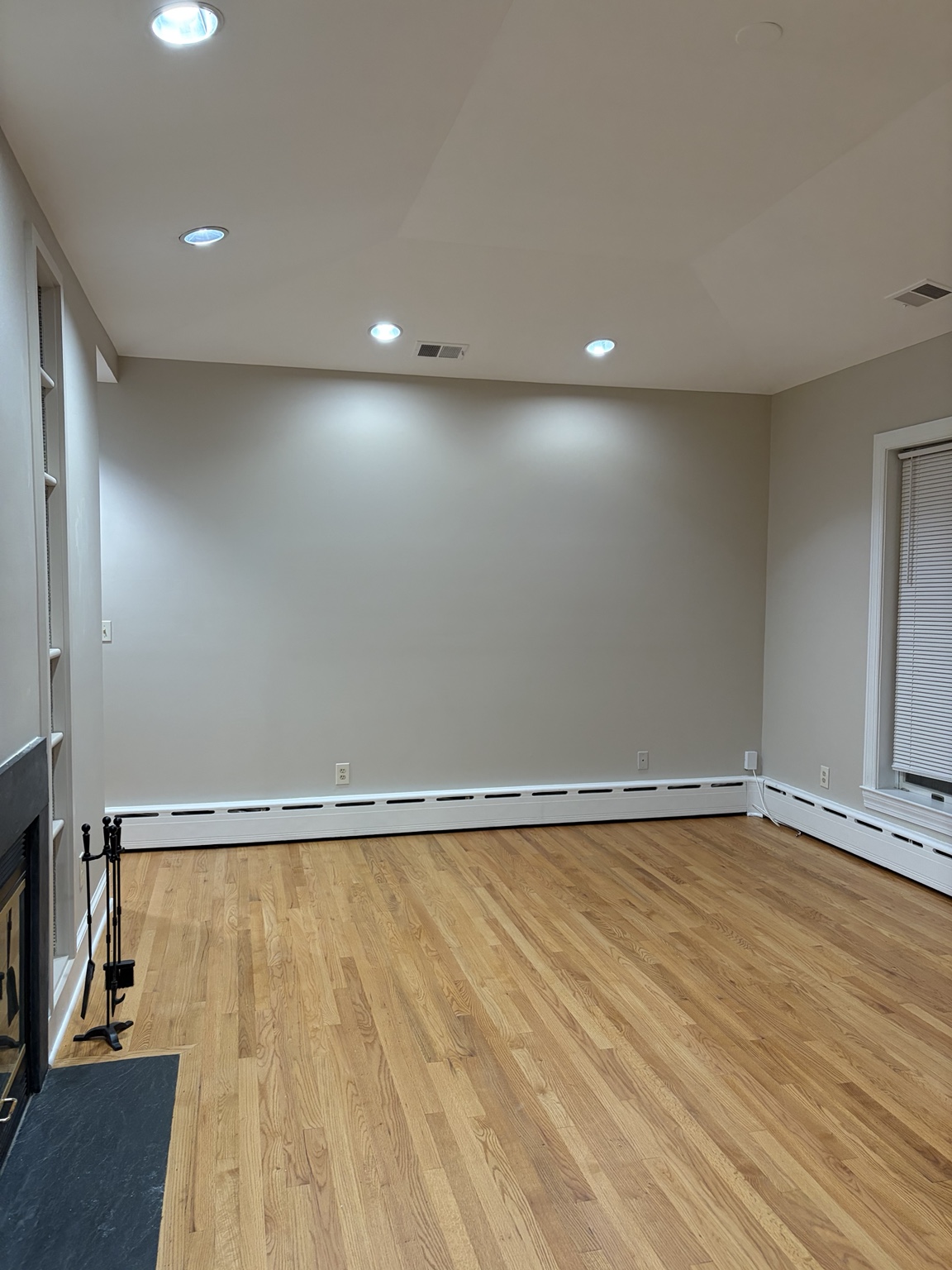 Kid Pro Service interior painting project with neutral walls, white trim and hardwood floors